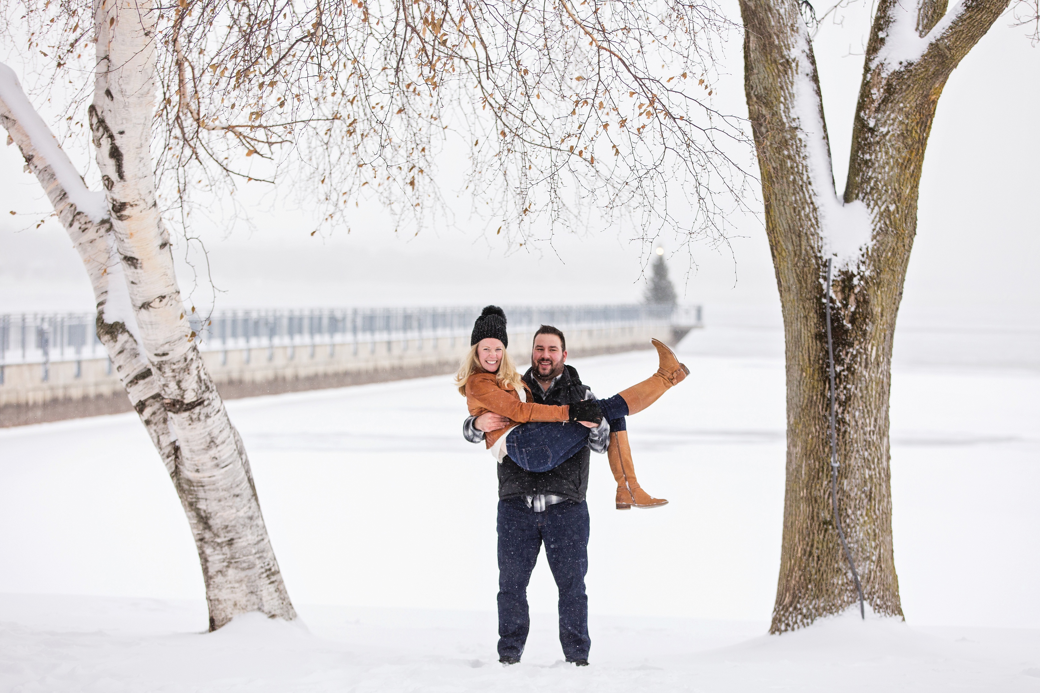 couple in front of skaneateles pier