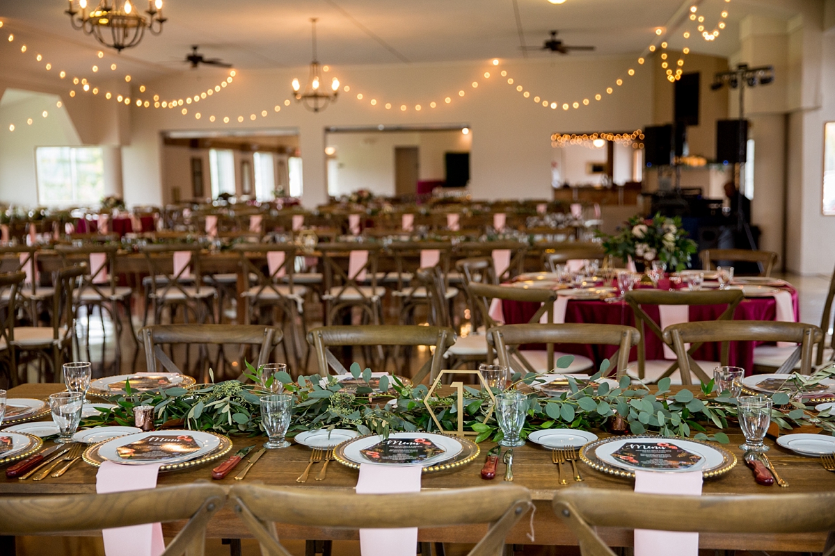 chantelle marie lakehouse and celebration venue, sarah heppell photography, reception at celebration venue, greenery as reception decor, eucalyptus table runners, farmhouse tables at wedding reception, bee themed wedding, 