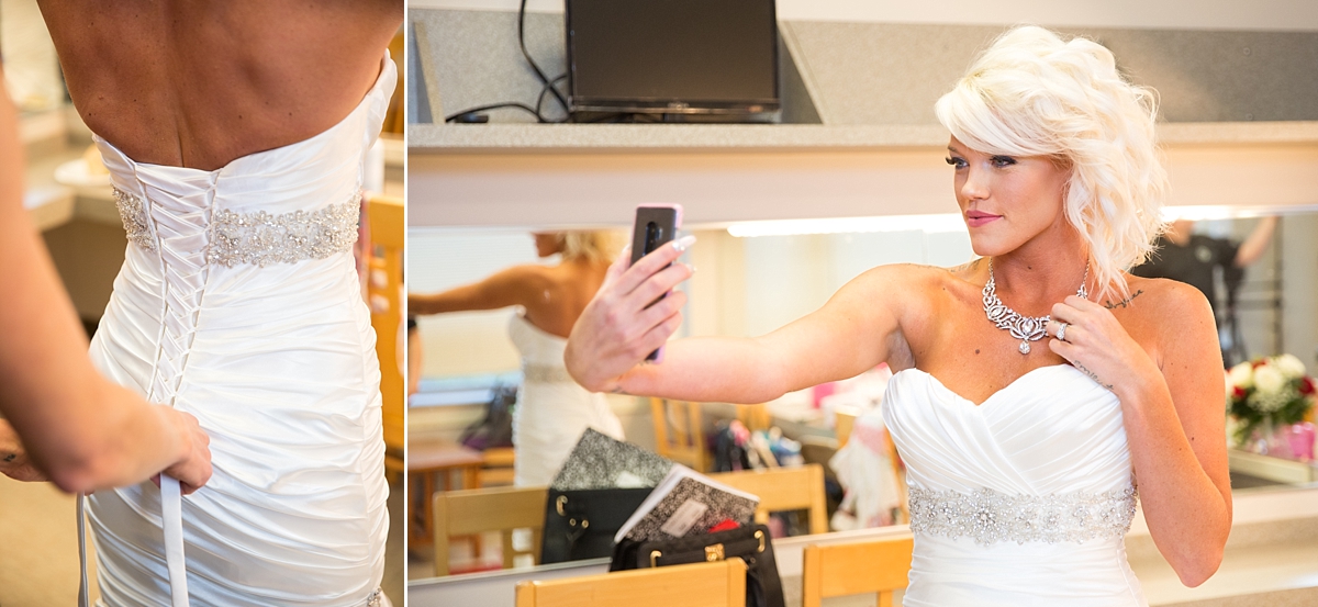 bride takes a selfie while getting ready at the landmark theatre, syracuse, ny, sarah heppell photography