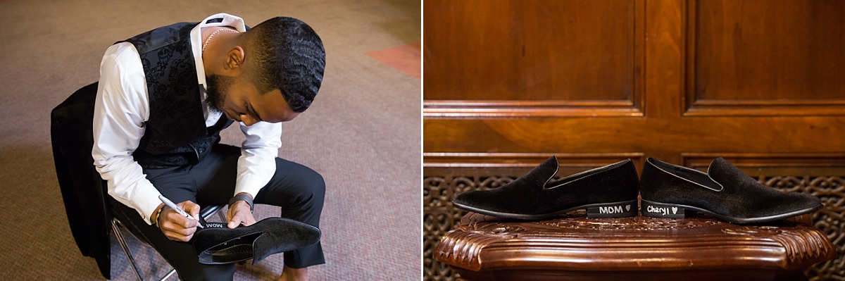 groom writes on shoes while getting ready at the landmark theatre 